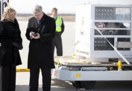 Canadian Prime Minister Harper signs for delivery of pandas